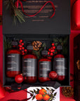 Nordic Botanics gift set with red bottles and decorative elements on a red background