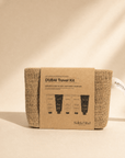 Dubai Travel Kit with five self-care products in a reusable woven pouch for skin and hair hydration on the go