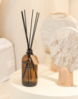 Neroli Reed Diffuser with natural essential oils in sleek glass bottle and rattan reeds