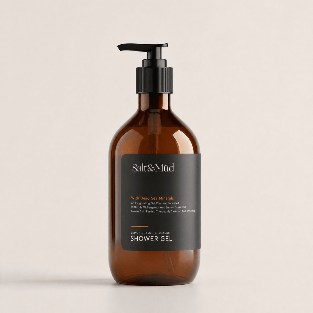Body wash with amber bottle, black pump and dark label, featuring Salt & Mūd Shower Gel branding; Body Wash Versus Bar Soap choice.
