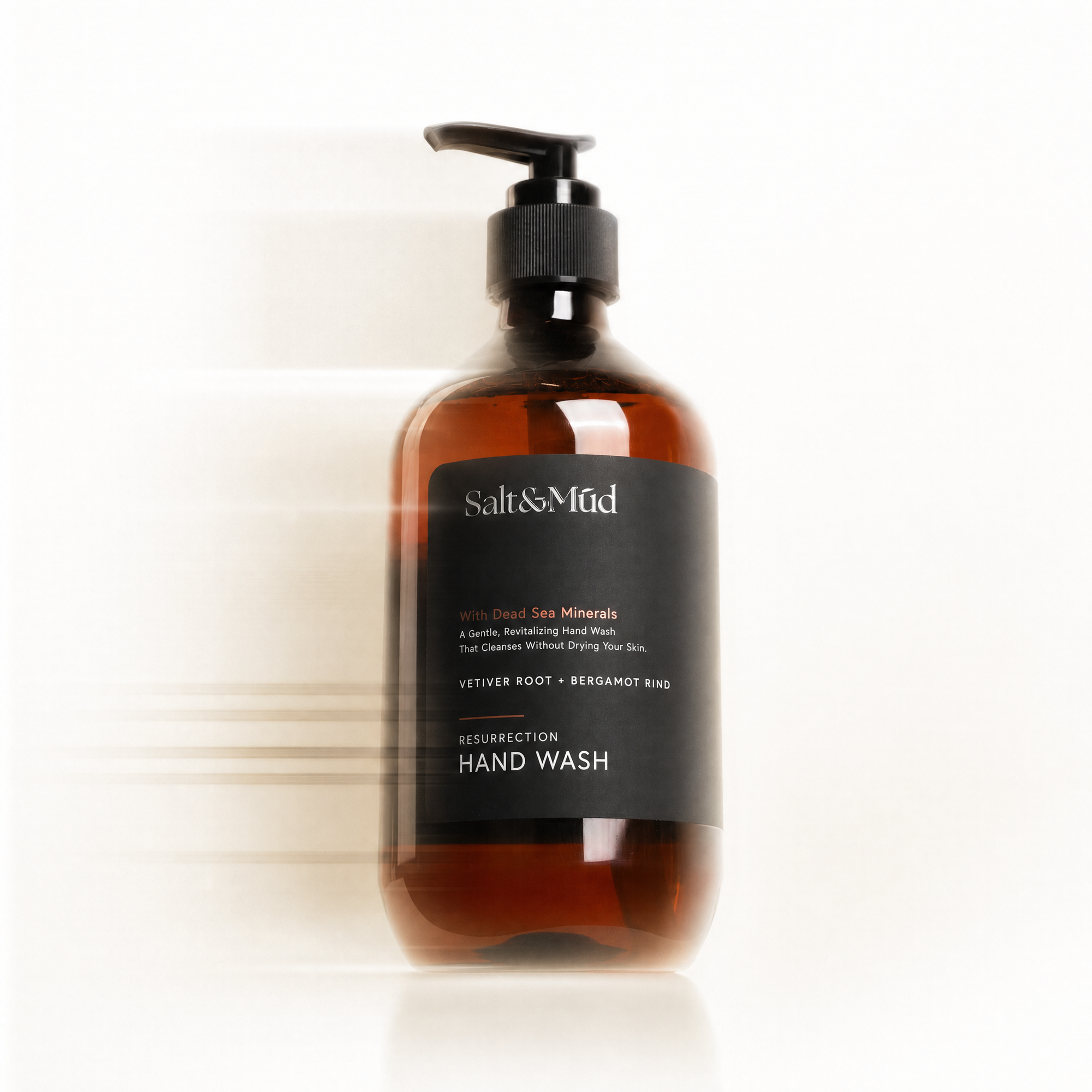 Bottle of Salt & Mud hand wash on a white background