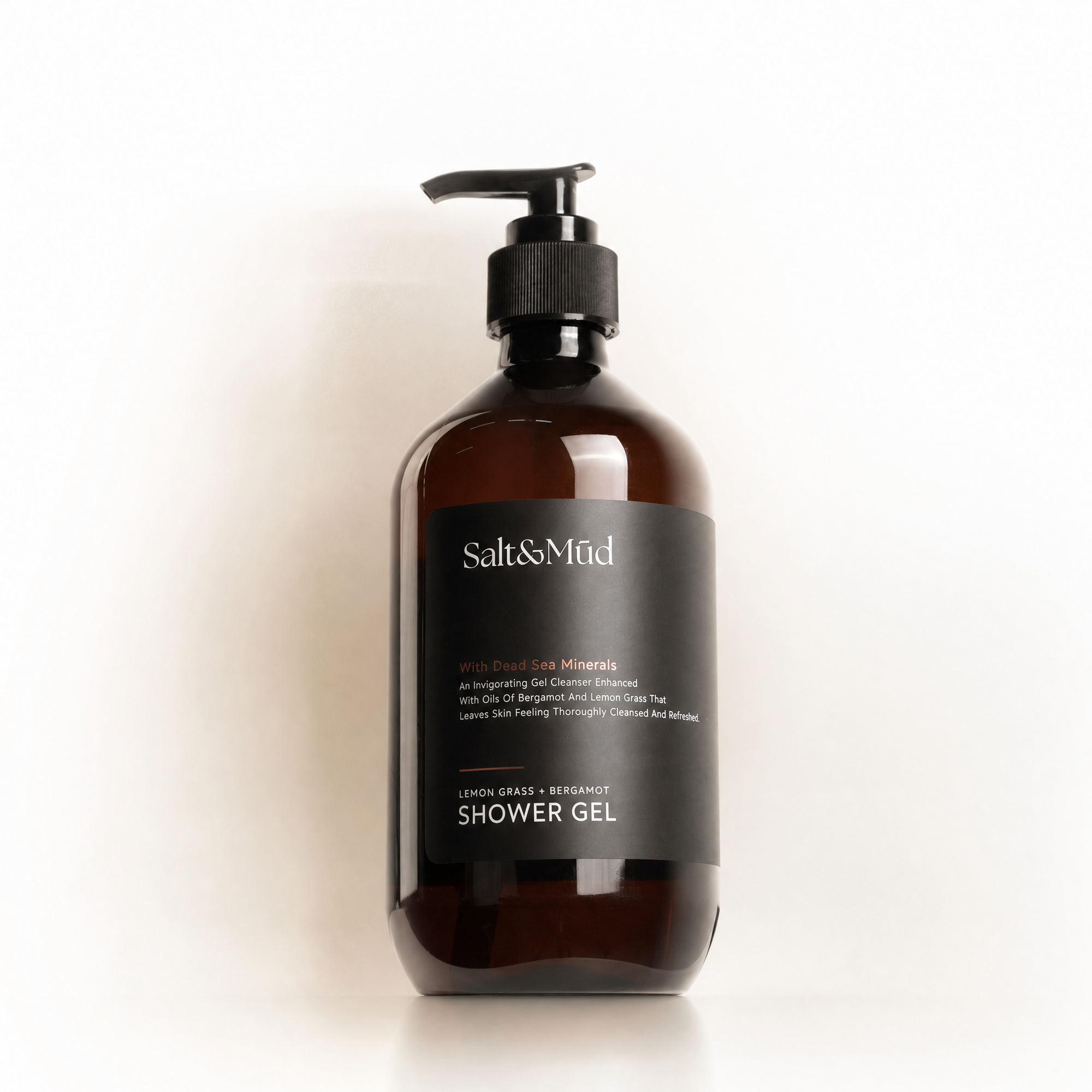 Brown bottle of shower gel with pump on a white background